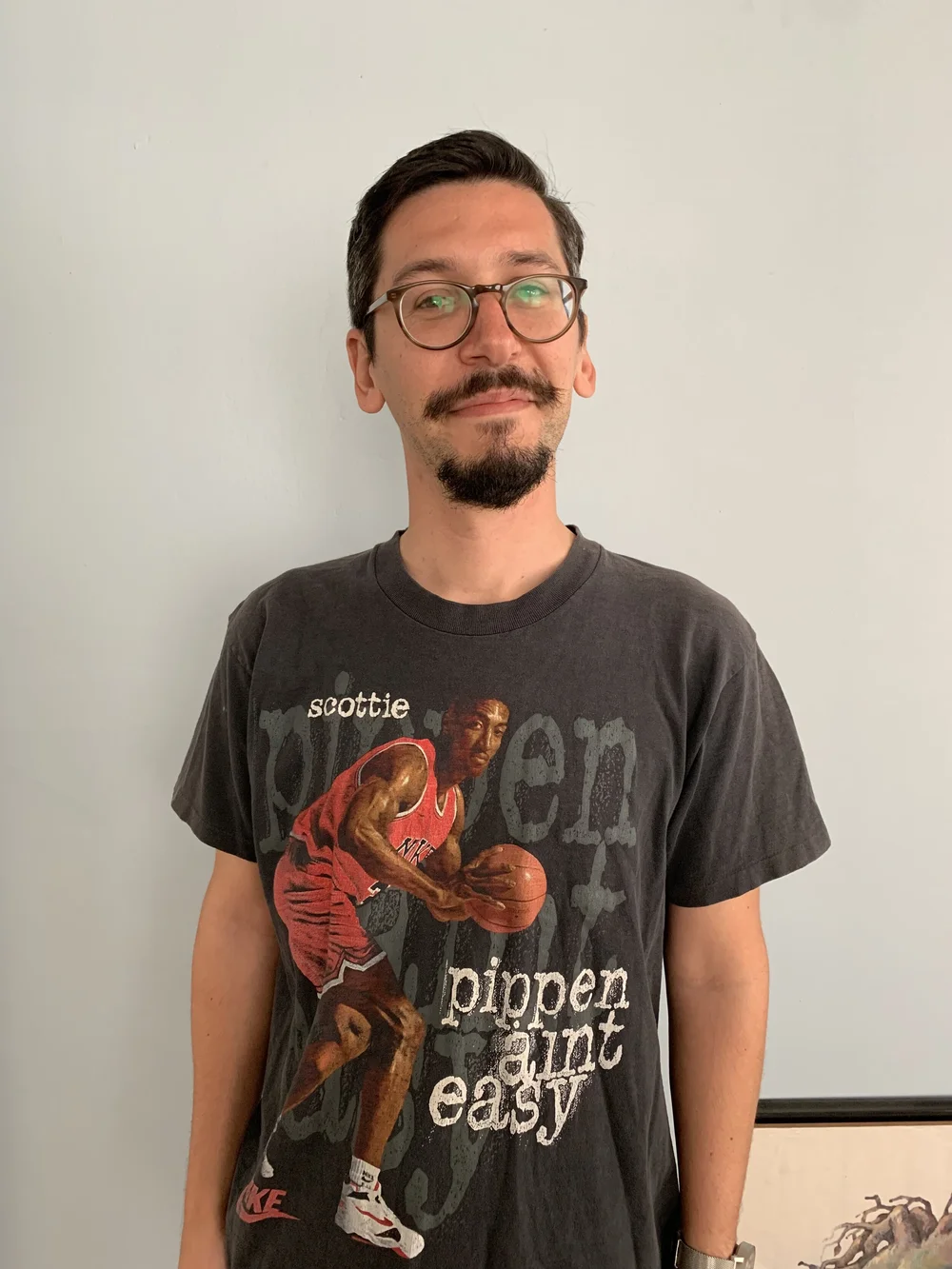 Micah Paisner wearing a Pippen Ain’t Easy T-shirt